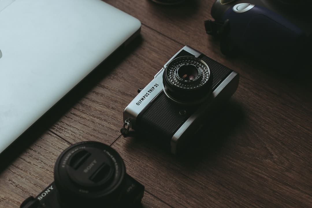 A laptop computer sitting on top of a wooden table clipping path photo editing ecommerce images - AI Bud