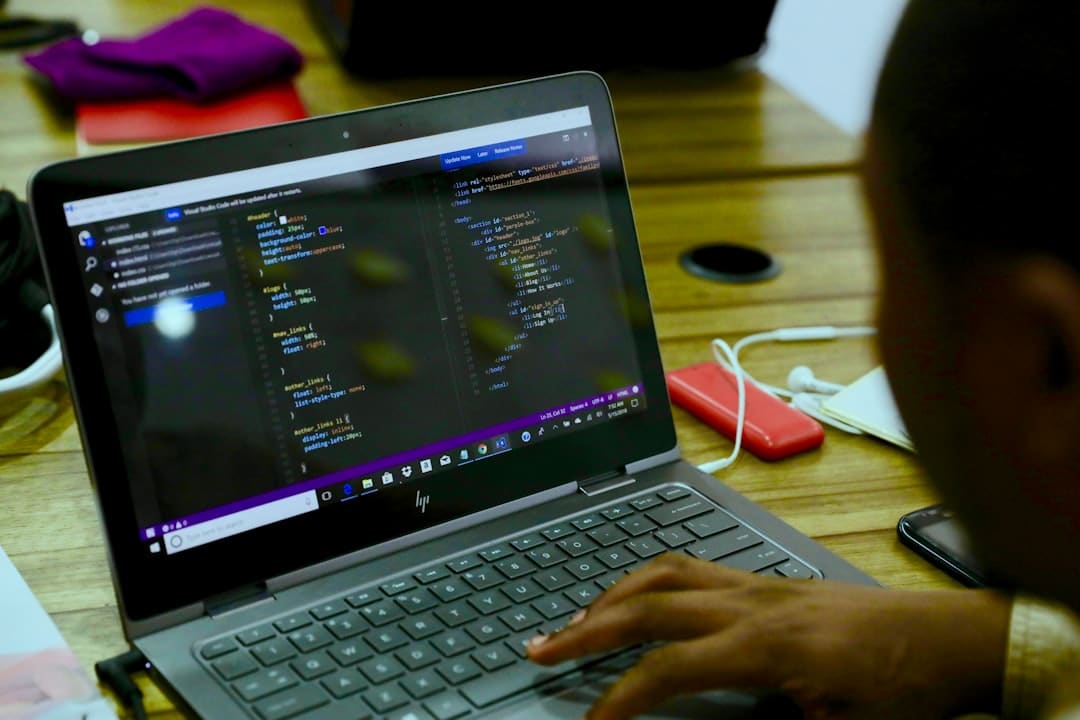 black HP laptop displaying C++ language cloud development online ide collaborative coding - AI Bud