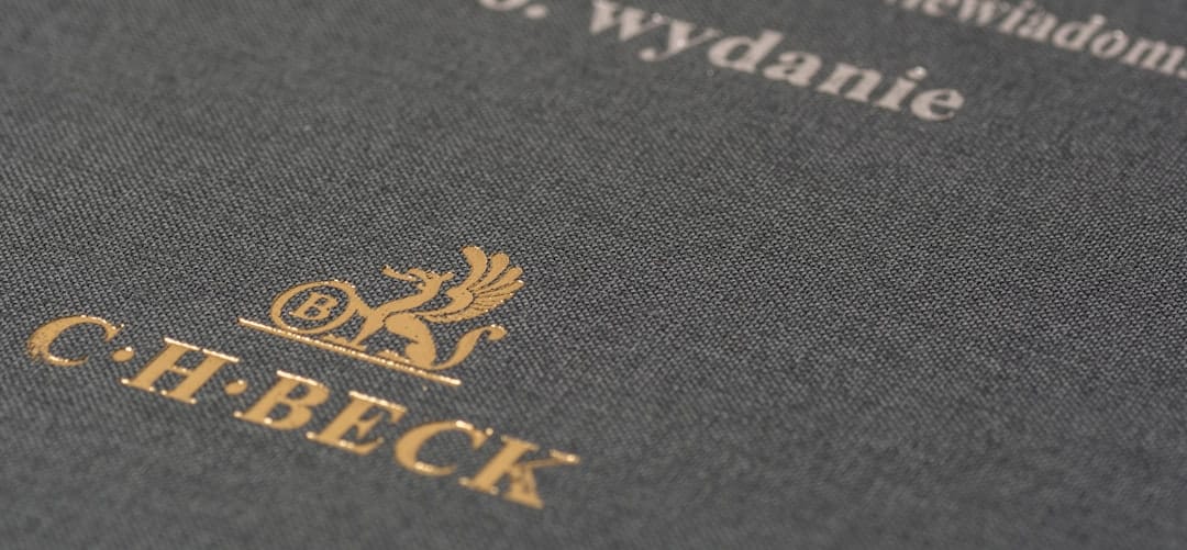 Close-up of a dark, textured book cover with gold embossed crest and the text C.H.BECK in serif lettering.