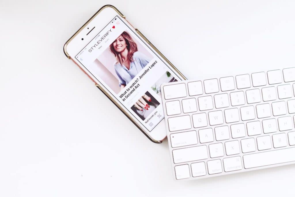 white iPhone under white Apple Magic Keyboard product quiz ecommerce chatbot fashion - AI Bud