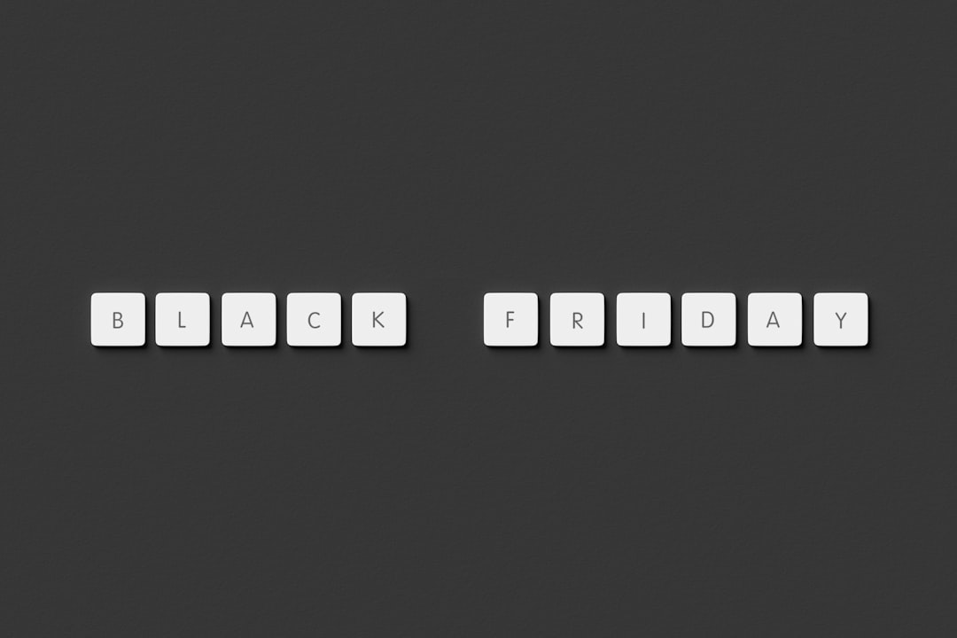 a black and white photo of a keyboard that says black friday wordpress seo plugin dashboard interface - AI Bud