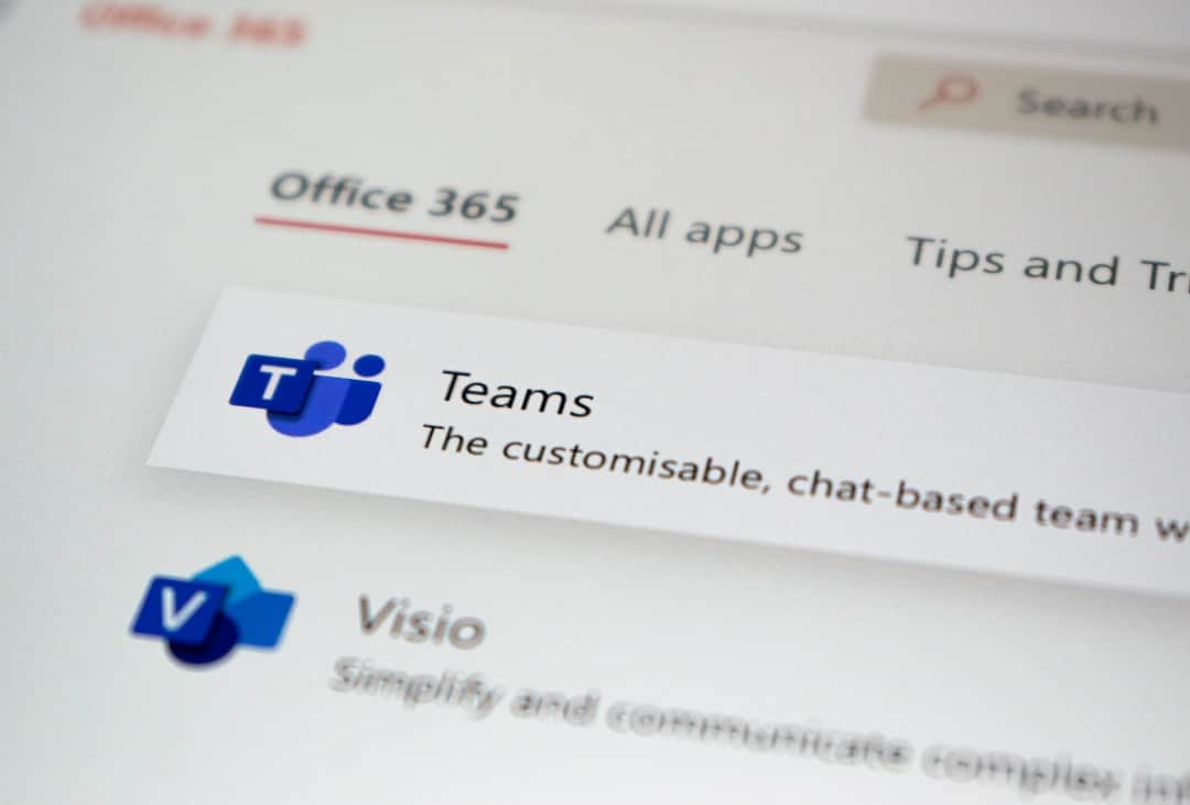 a close up of a computer screen with some stickers on it technology tools employee tracking virtual team - AI Bud