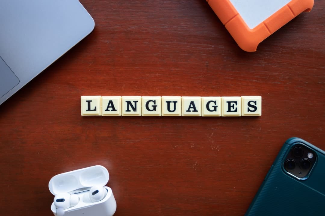 a close up of a wooden block that says languages seo multilingual site global search optimization language url structure - AI Bud