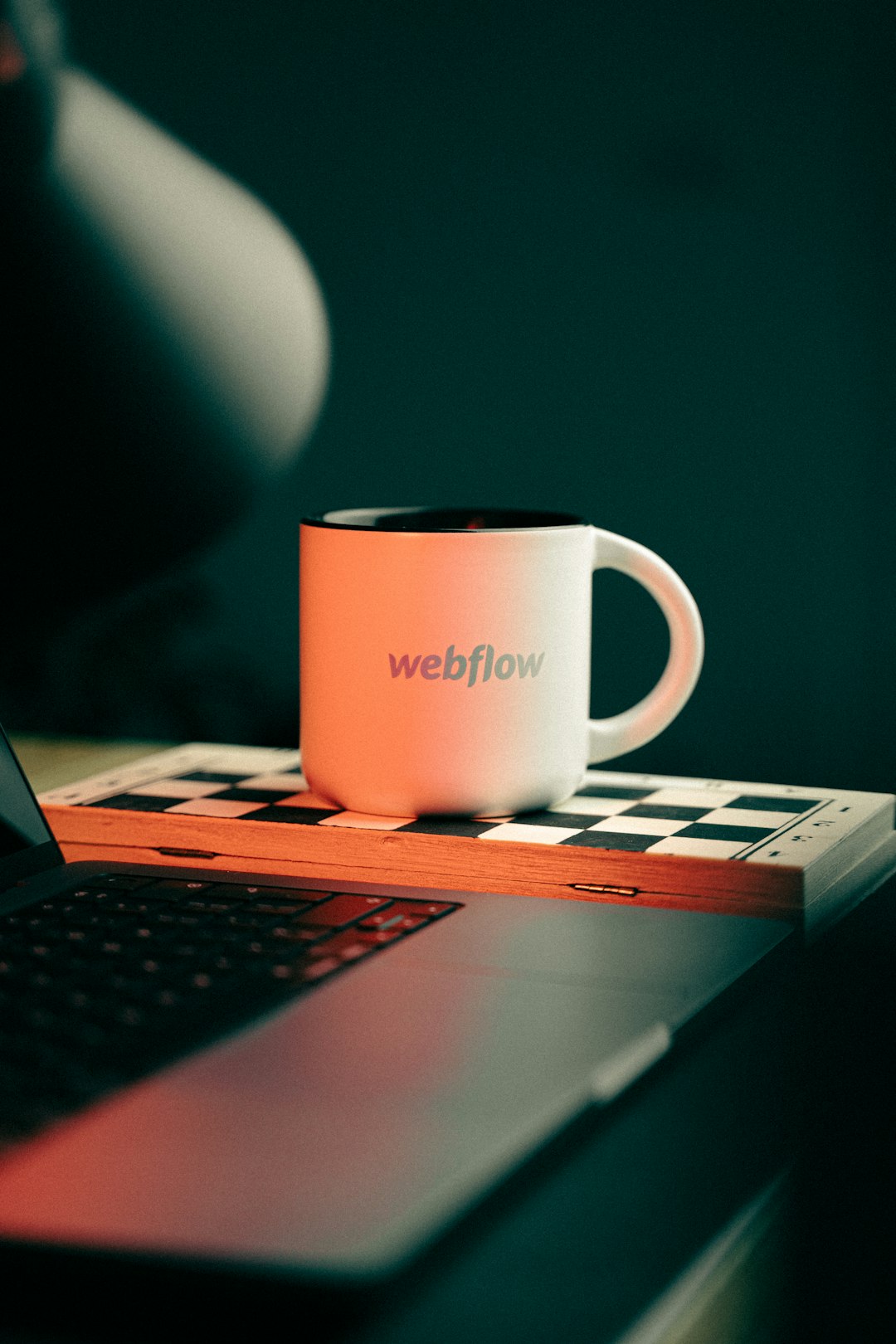 a coffee mug sitting on top of a laptop computer future of wordpress design evolution web development - AI Bud