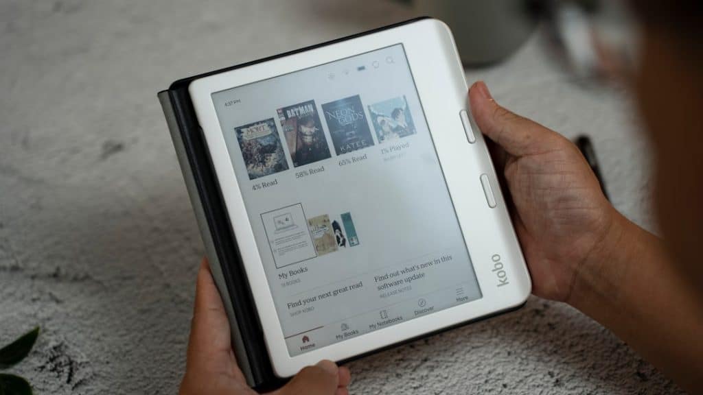 A person holding a tablet with a page on it ebooks downloads digital content website - AI Bud