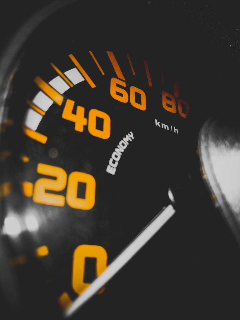 black speedometer close-up photography website speed slow loading pages performance analytics - AI Bud