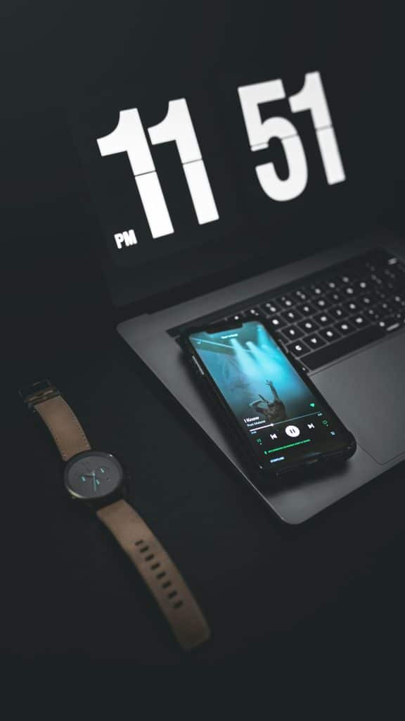 digital clock displaying 1151 pm mobile user experience divi theme wordpress customization - AI Bud