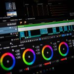 Video editing software interface showing a color grading panel with three circular color wheels on a dark screen