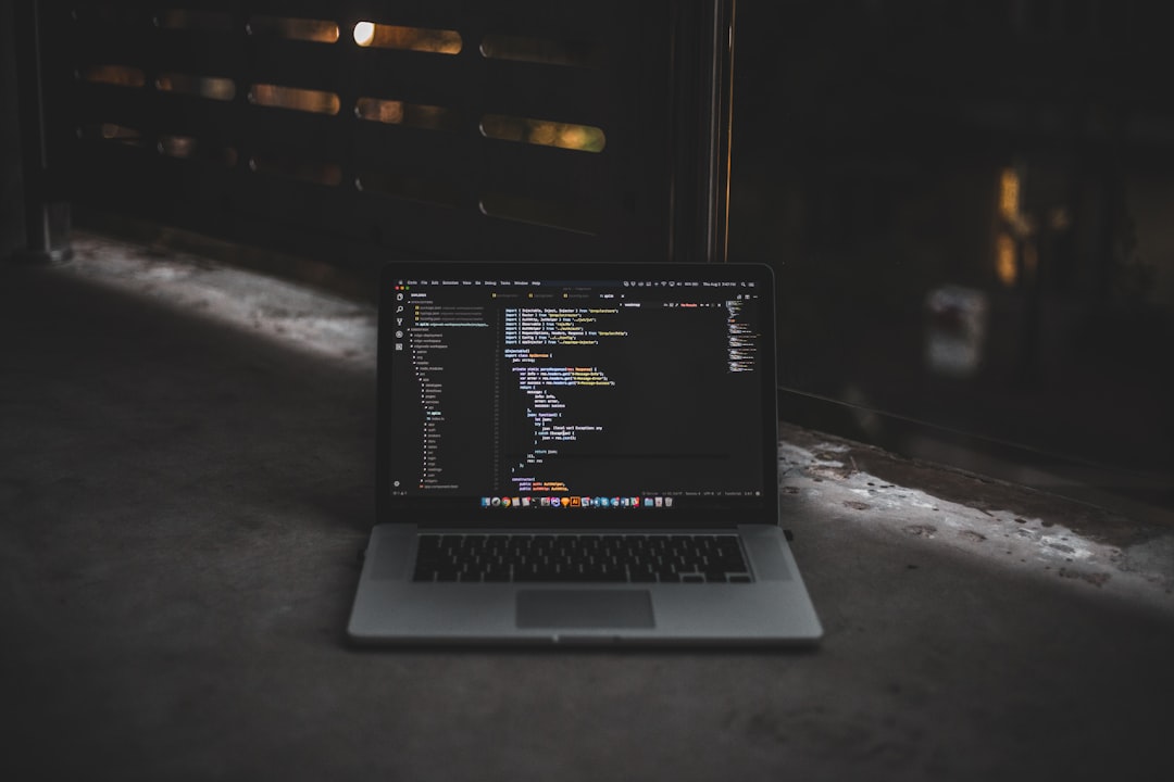MacBook Pro inside gray room setup steps code snippet web developer - AI Bud