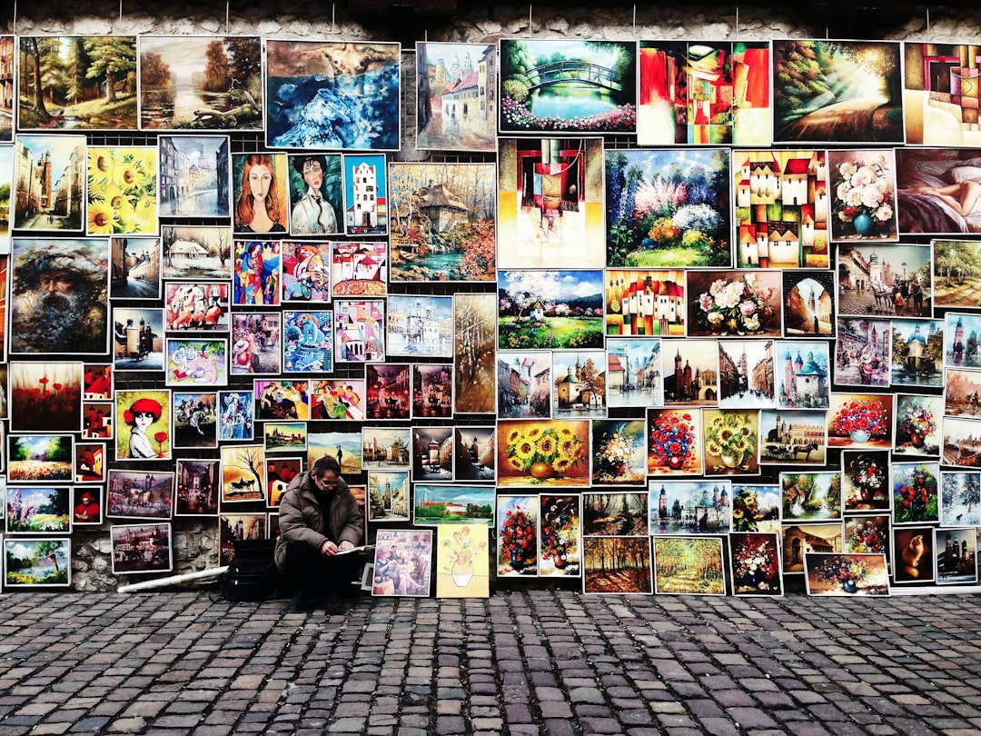 man sitting beside painting lot 360 panorama viewer virtual tour wordpress plugin - AI Bud