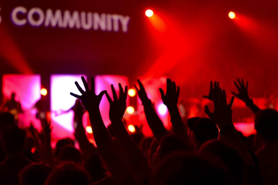 people raises hands community engagement polls questions - AI Bud