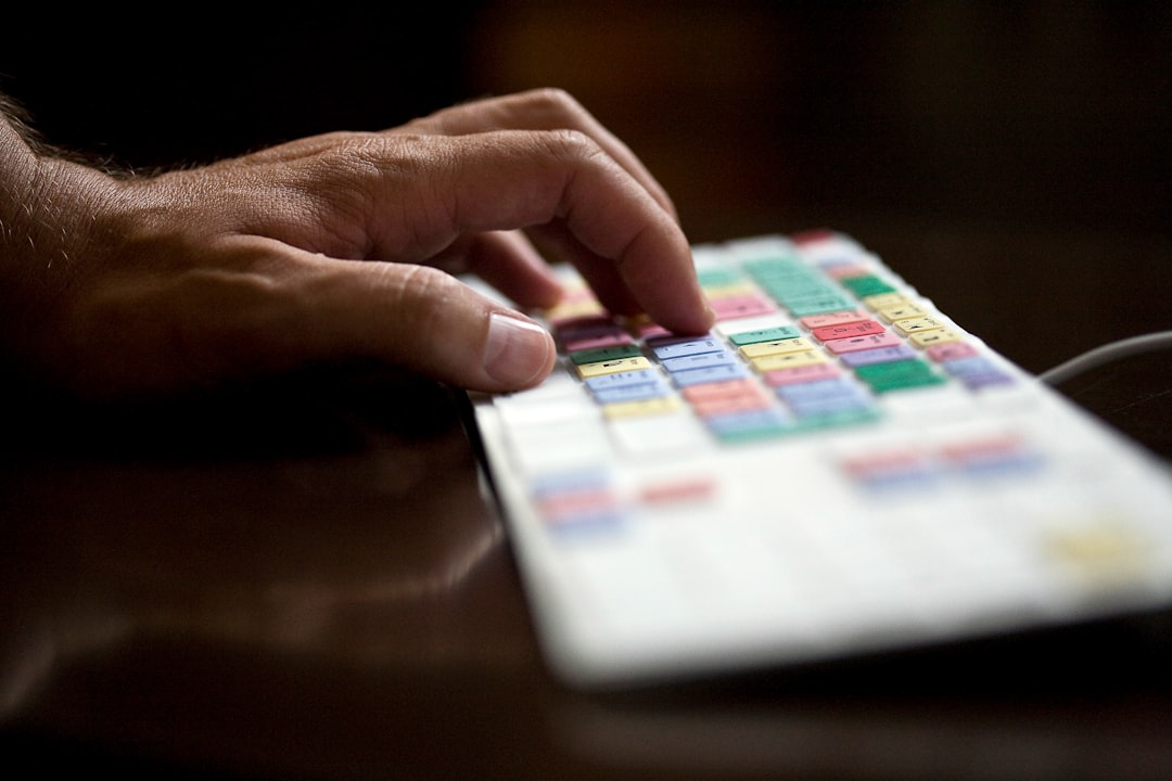 person holding white and blue box pos screen colorful buttons food categories - AI Bud