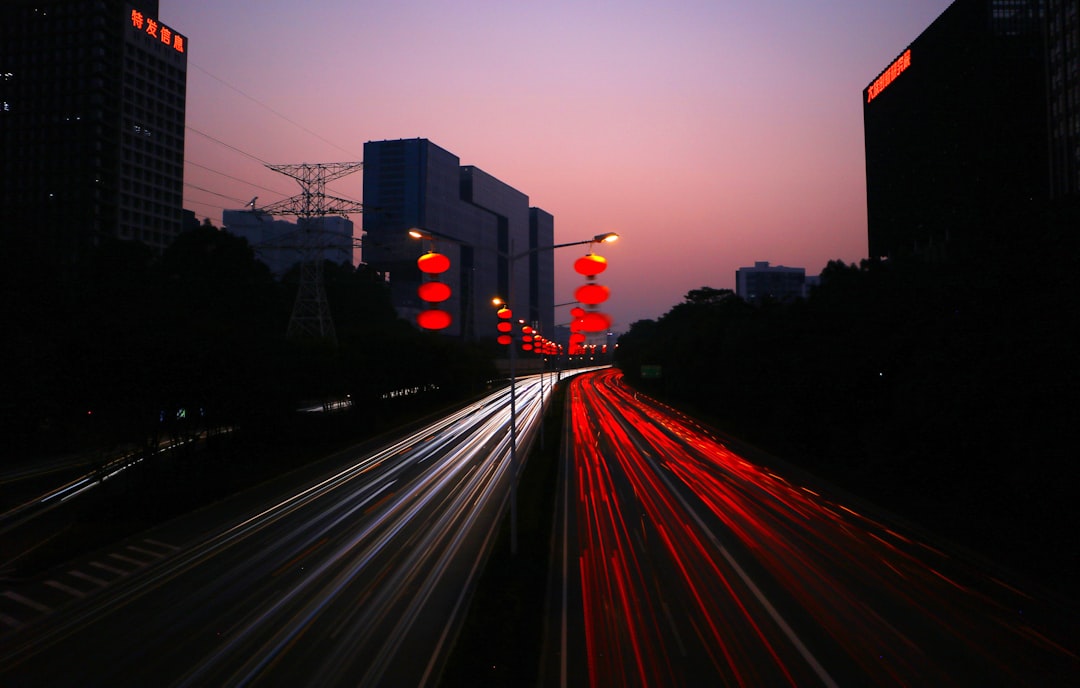 timelapes photography of car lights on road during night time web traffic analytics SEO - AI Bud