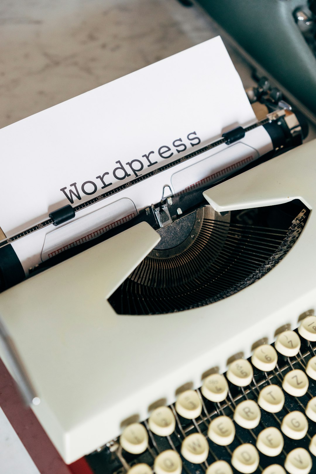 white and black typewriter on white table divi theme blog module wordpress grid - AI Bud