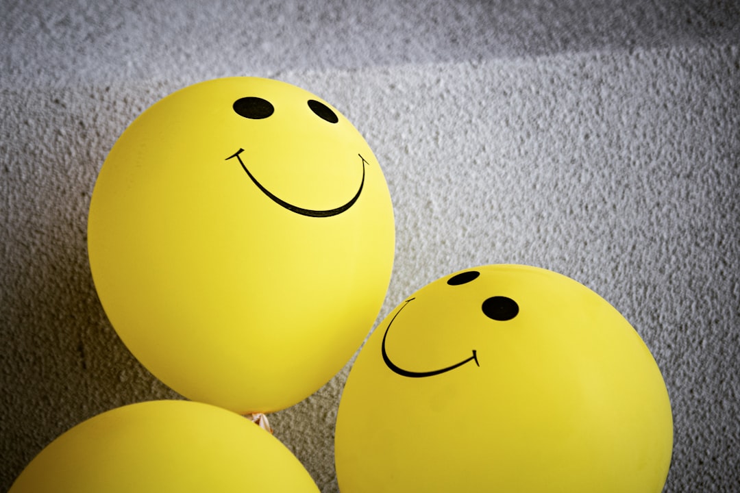 yellow smiley emoji on gray textile happy users chatting online website community - AI Bud