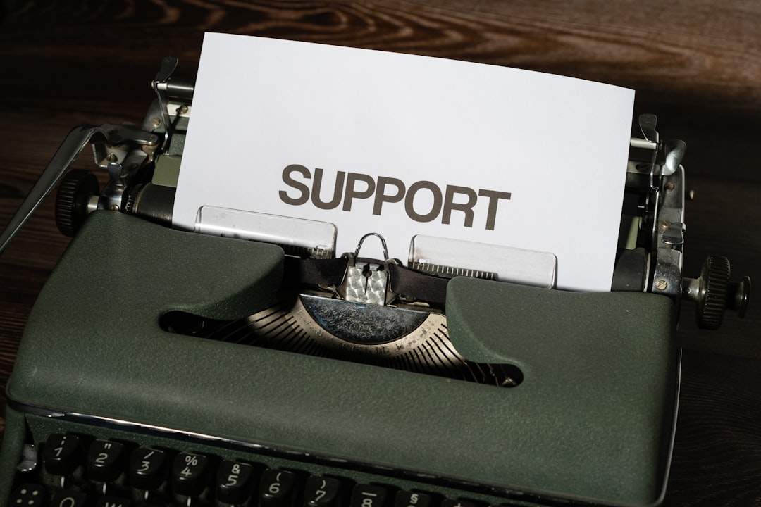 a close up of a typewriter with a paper on it wordpress customer support plugins choose ticketing solution helpdesk software - AI Bud