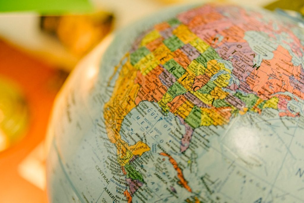 A colorful globe shows north america website localization multilingual design global audience - AI Bud