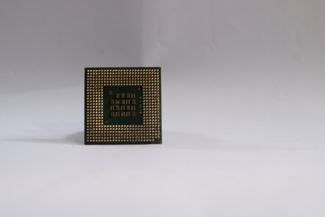 a small square object with a green and black design on it ryzen cpu intel cpu processor comparison - AI Bud