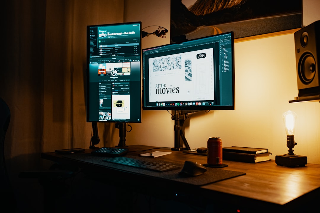 black flat screen tv turned on on brown wooden tv rack wp engine studio press themes agency management - AI Bud