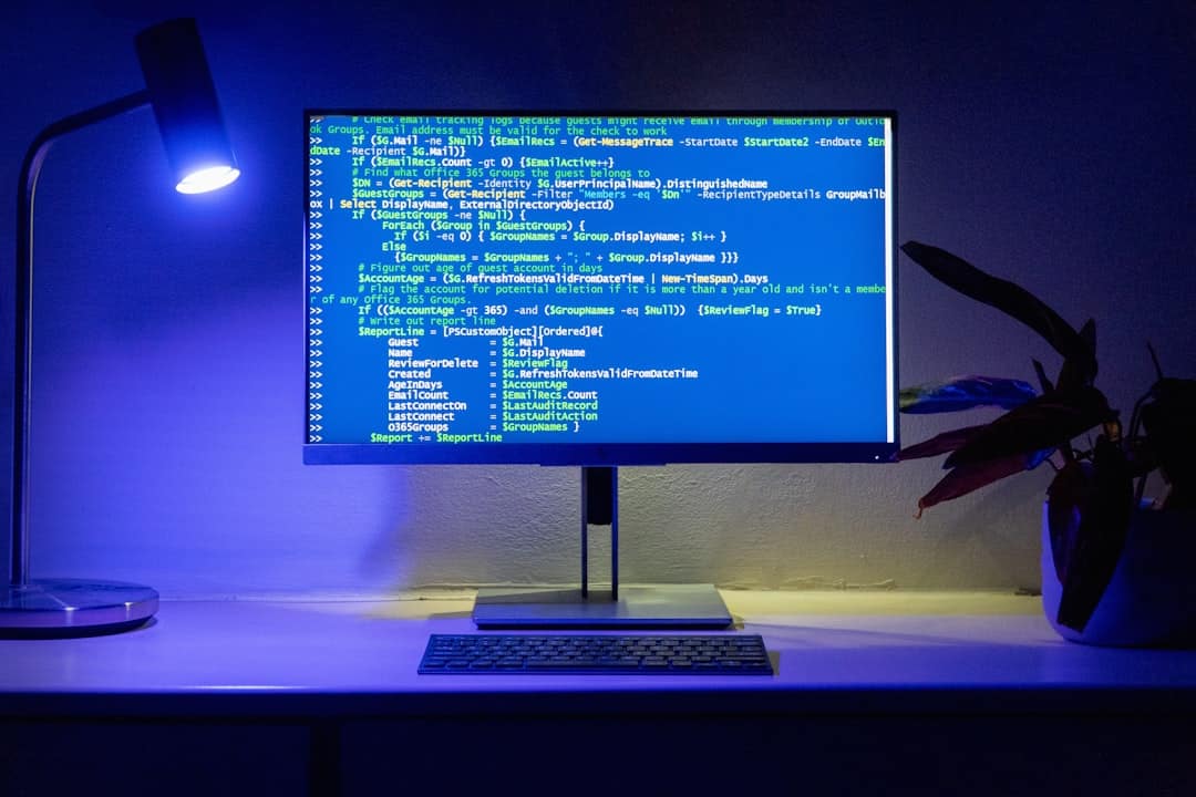 Code is displayed on a computer monitor website update computer security helpdesk support - AI Bud