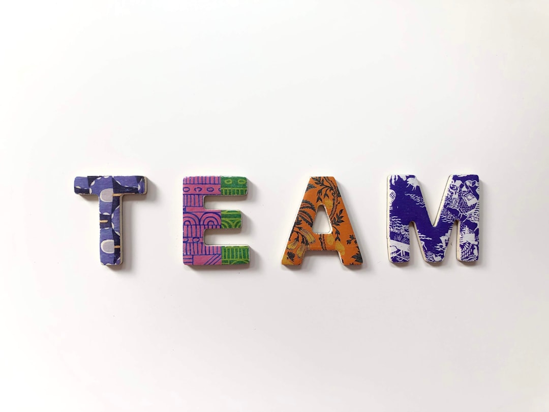 team freestanding letters team collaboration ai writing tools content planning - AI Bud