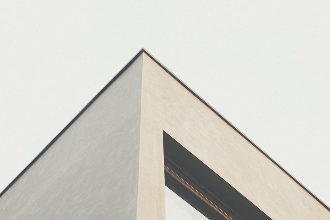 white concrete building low-angle photography theme builder divi settings post template - AI Bud