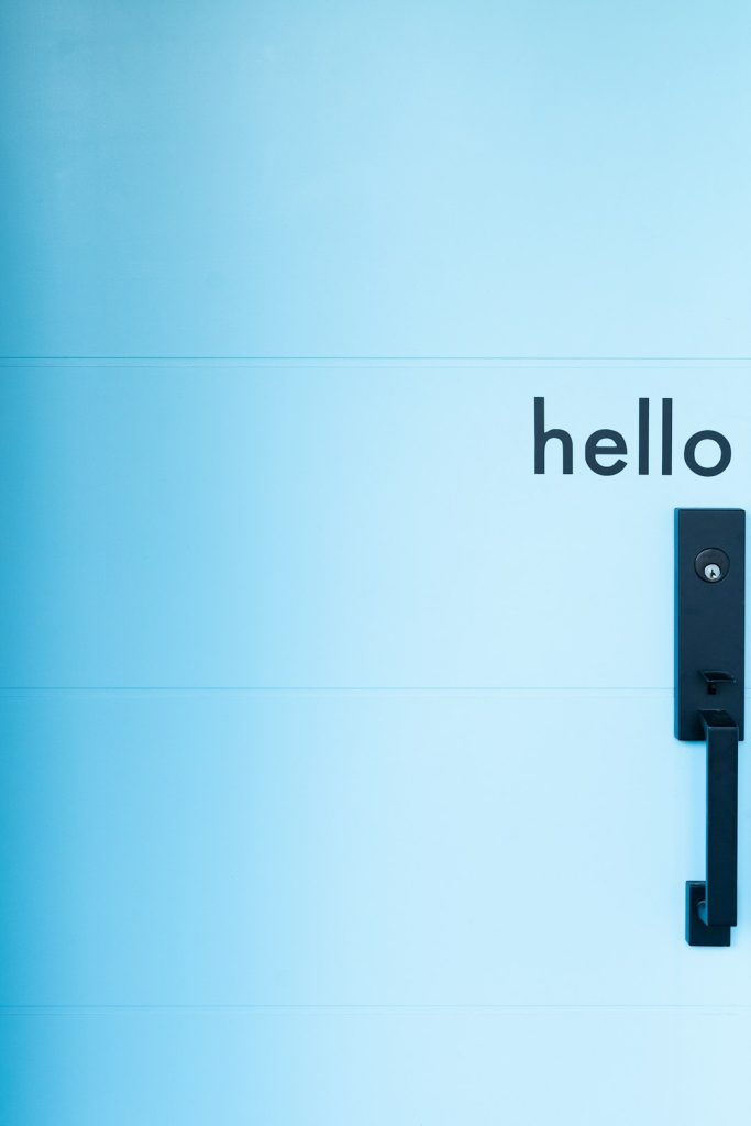 a black door handle on a blue wall chatbot styling color customization brand integration - AI Bud