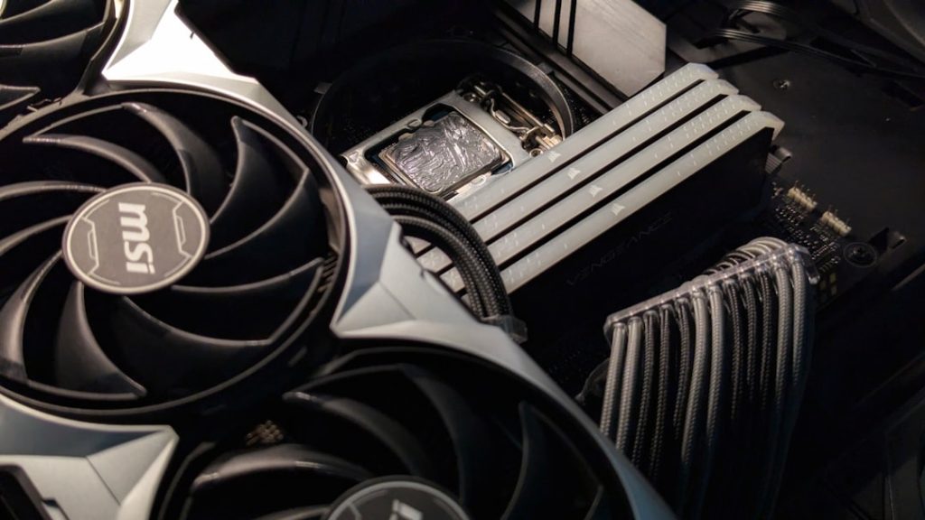 A close up of a computer motherboard and fan gaming pc cpu cooler pc build - AI Bud