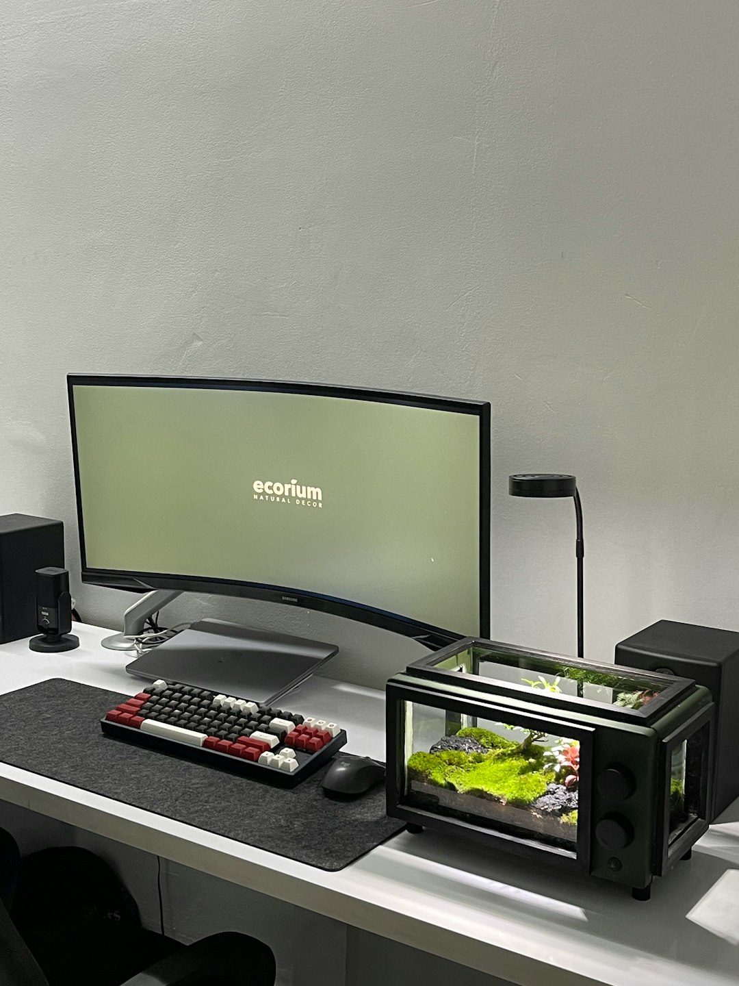 a desk with a monitor keyboard and a remote control gaming pc case setup desk - AI Bud