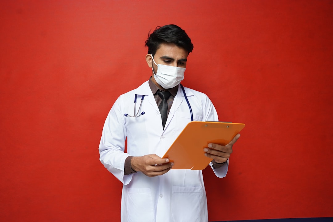a doctor holding a tablet healthcare document ai automation - AI Bud