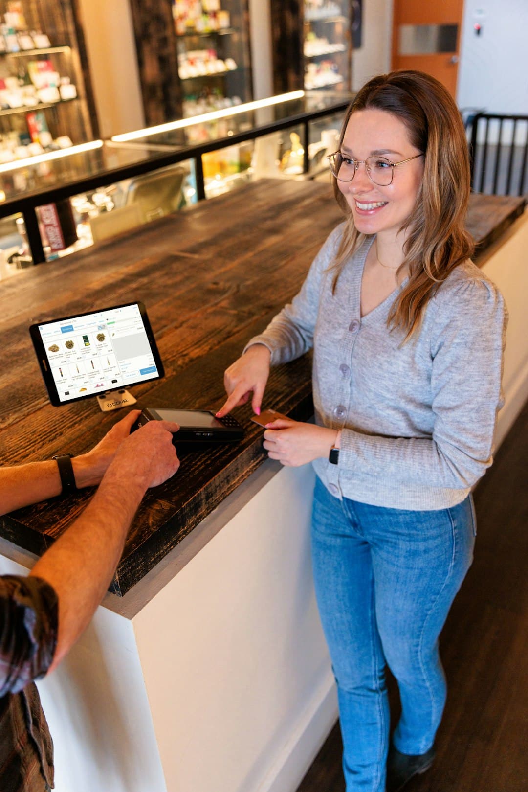 a man and a woman standing at a counter customer service ai chatbots personalized shopping - AI Bud
