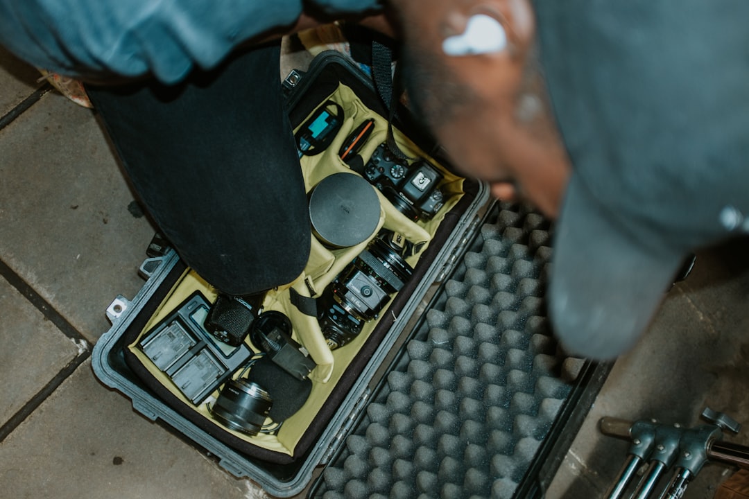 a person standing over a piece of equipment in a case rz g3s repair service center button replacement - AI Bud