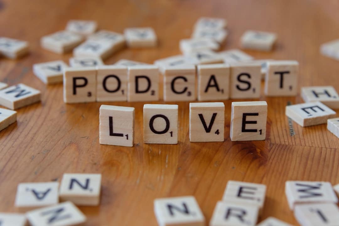A wooden table topped with scrabble letters spelling out the word love students diversity science lab podcast discussion - AI Bud