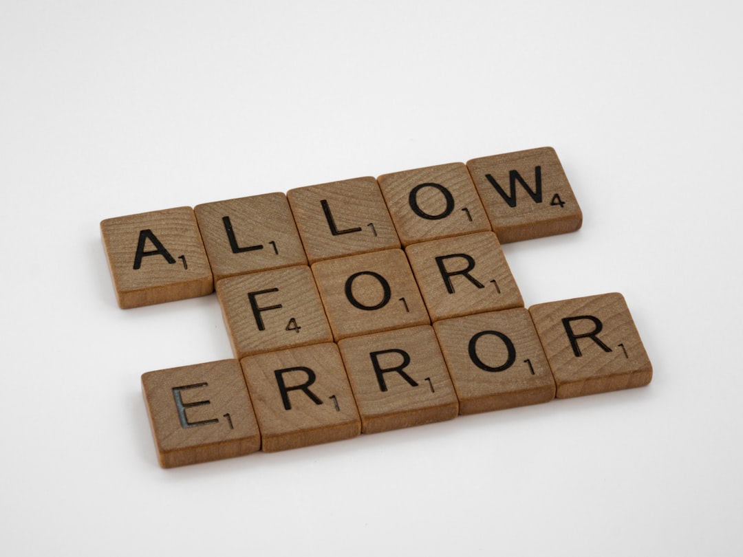 brown wooden blocks on white surface outlook error dialog pst file issue user frustrated - AI Bud
