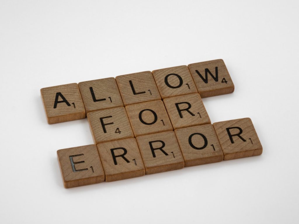 brown wooden blocks on white surface outlook error dialog pst file issue user frustrated - AI Bud