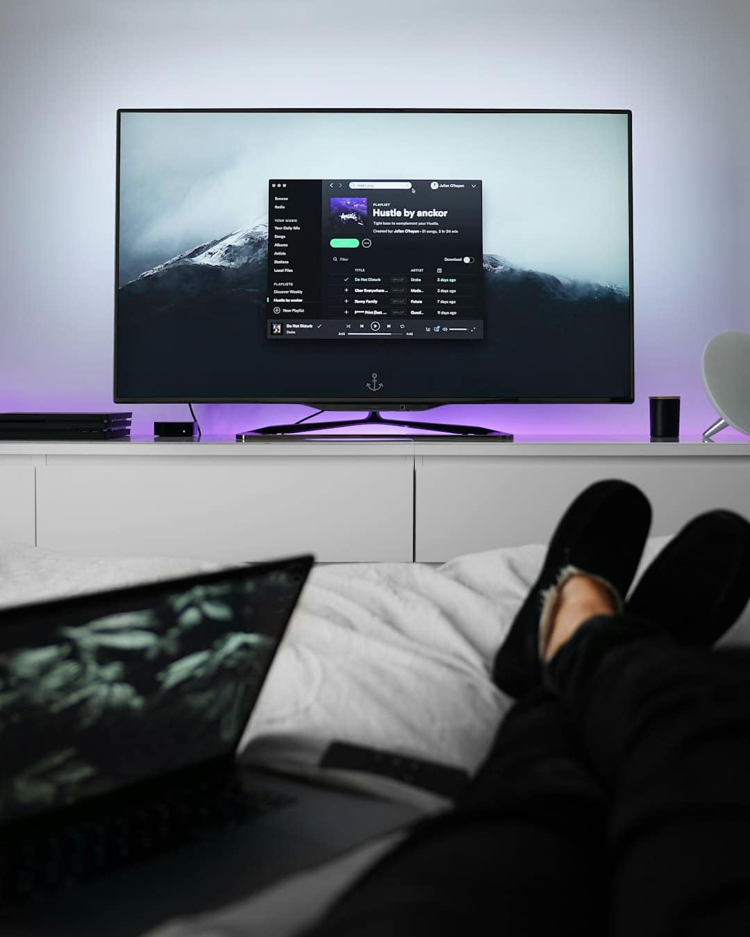 flat screen TV turned on relaxed person tv streaming cozy living room watching movies - AI Bud