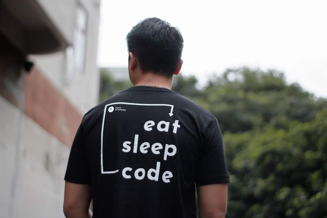 man wearing black shirt developers ai coding team collaboration - AI Bud
