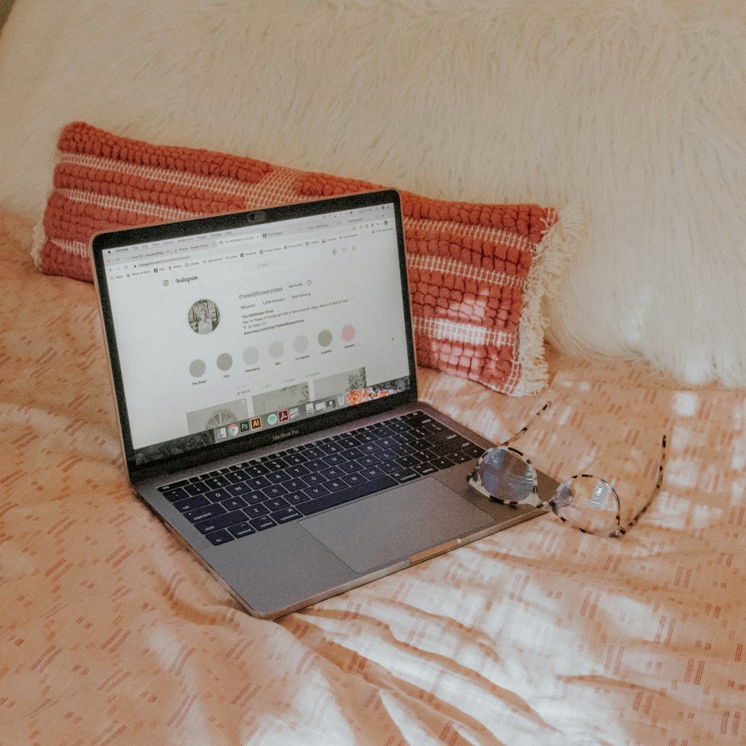 turned-on MacBook Pro beginner blogger writing on laptop cozy environment - AI Bud