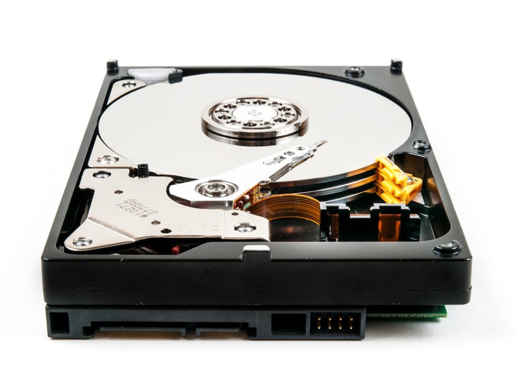 a hard drive that is open on a white surface zfs scrub data recovery process hard drives - AI Bud