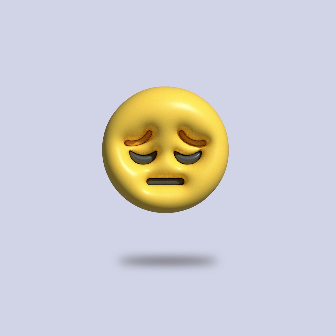 Yellow sad/weary emoji with drooping eyes and a straight mouth, floating above a soft shadow on a light purple background.