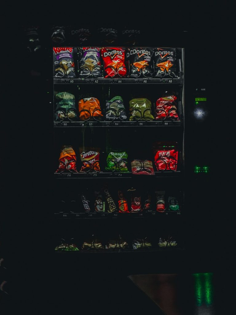 a vending machine filled with assorted snacks primogel goo minecraft item inventory screen - AI Bud