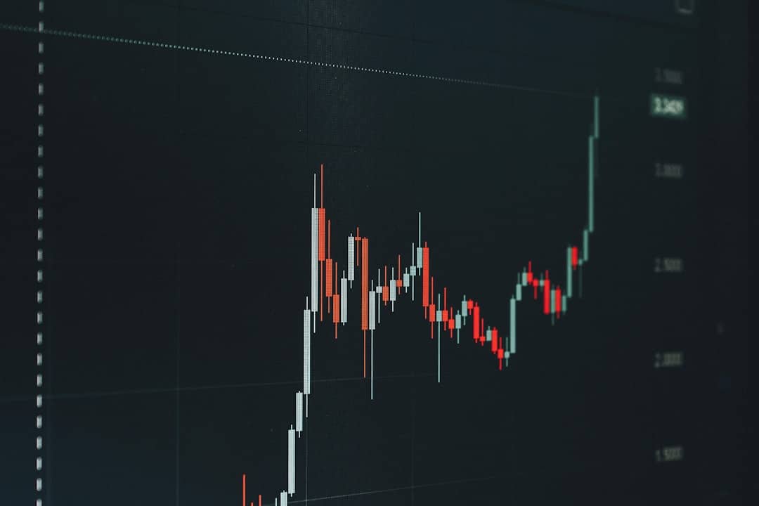 Stock chart with white and red/green candlesticks showing a price rise, on a dark background.