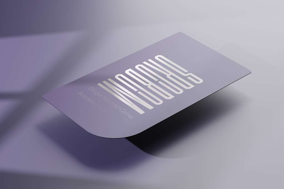 Lavender business card with a bold, stylized white wordmark on a soft purple background.