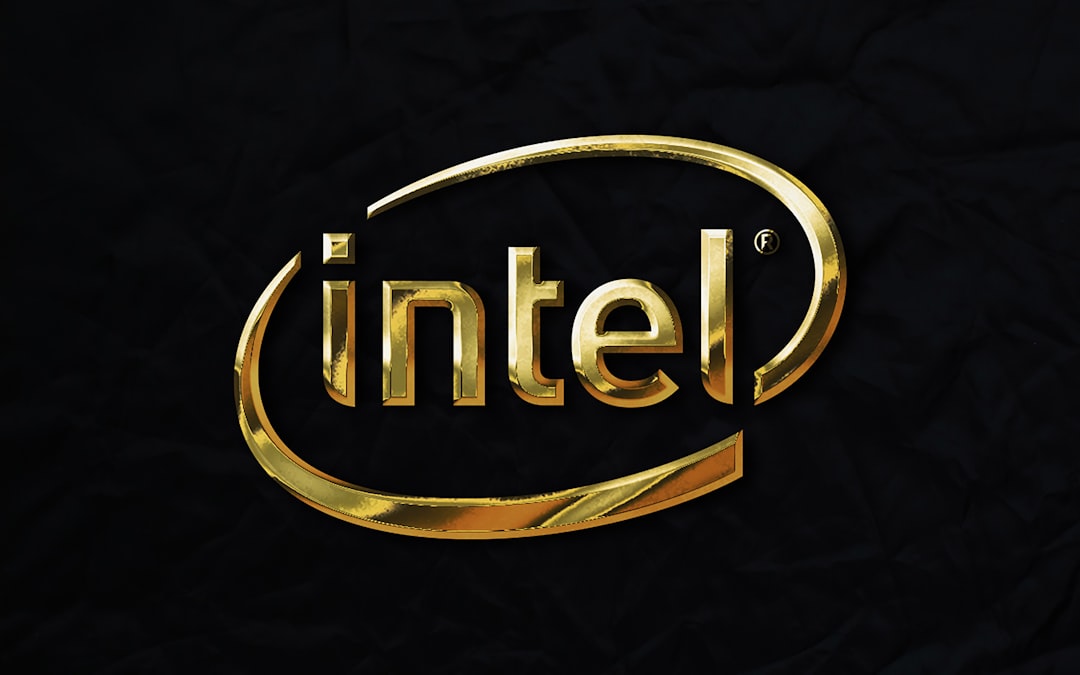 Gold Intel logo on a dark textured background conveying luxury branding