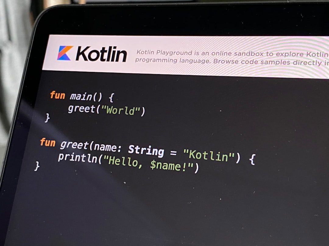 Screen showing Kotlin code: main() prints 'World' greeting; Kotlin logo banner at top.