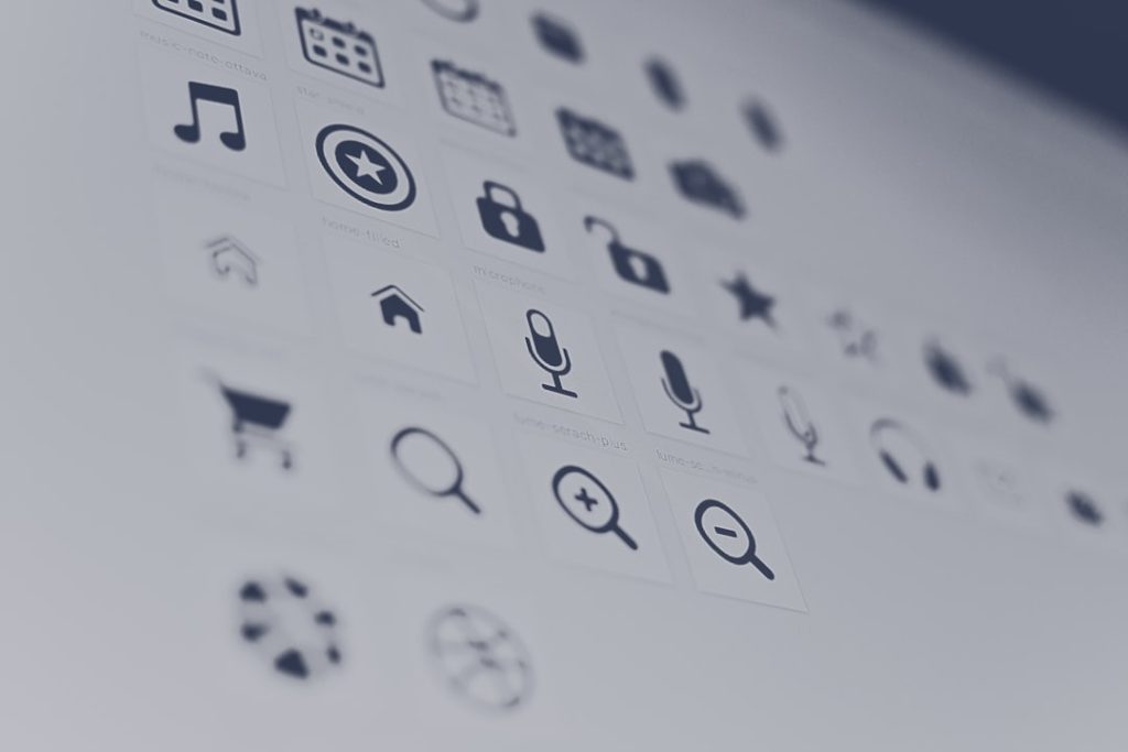 Grid of app icons on a computer screen, slightly blurred.