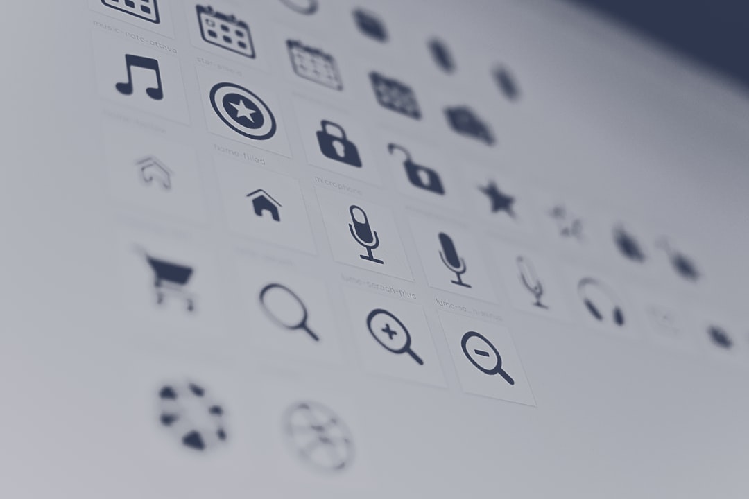 Grid of app icons on a computer screen, slightly blurred.