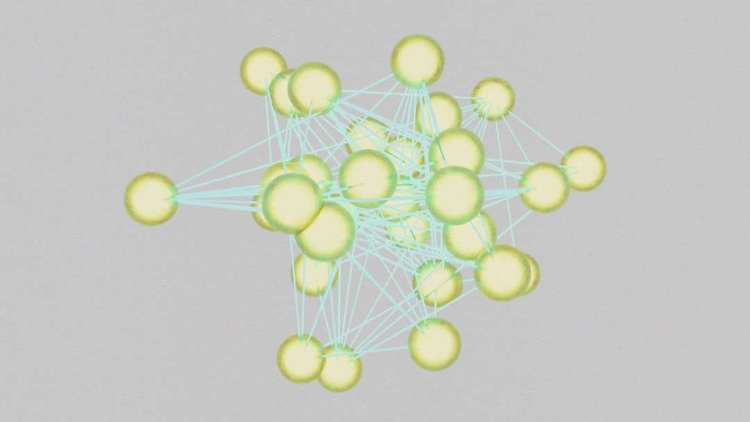 Three-dimensional network graph of yellow spheres connected by light-blue lines, forming a complex web.