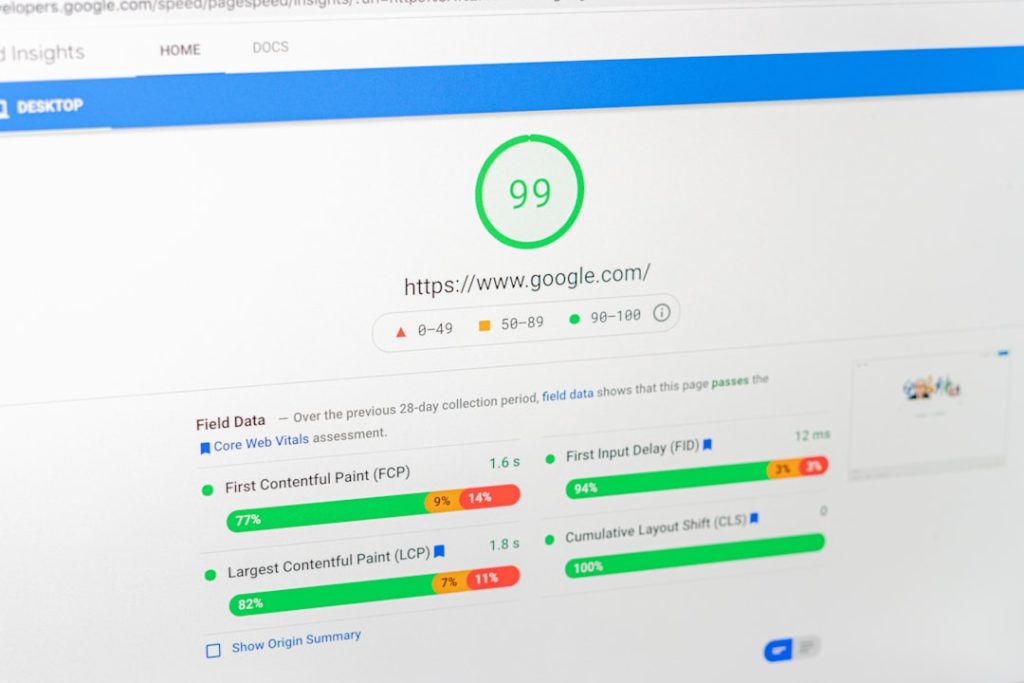 Green circular score badge showing 99 for https://www.google.com/ with performance metrics and charts below (web vitals page)