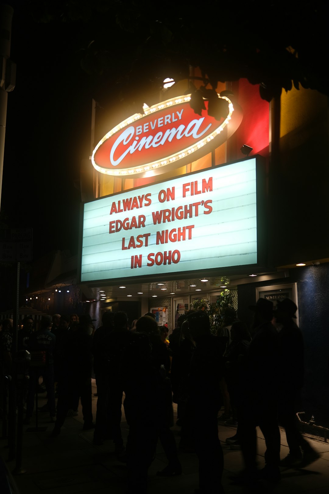 Beverly Cinema marquee at night with bright sign and a crowd outside; board reads 'ALWAYS ON FILM EDGAR WRIGHT'S LAST NIGHT IN SOHO'